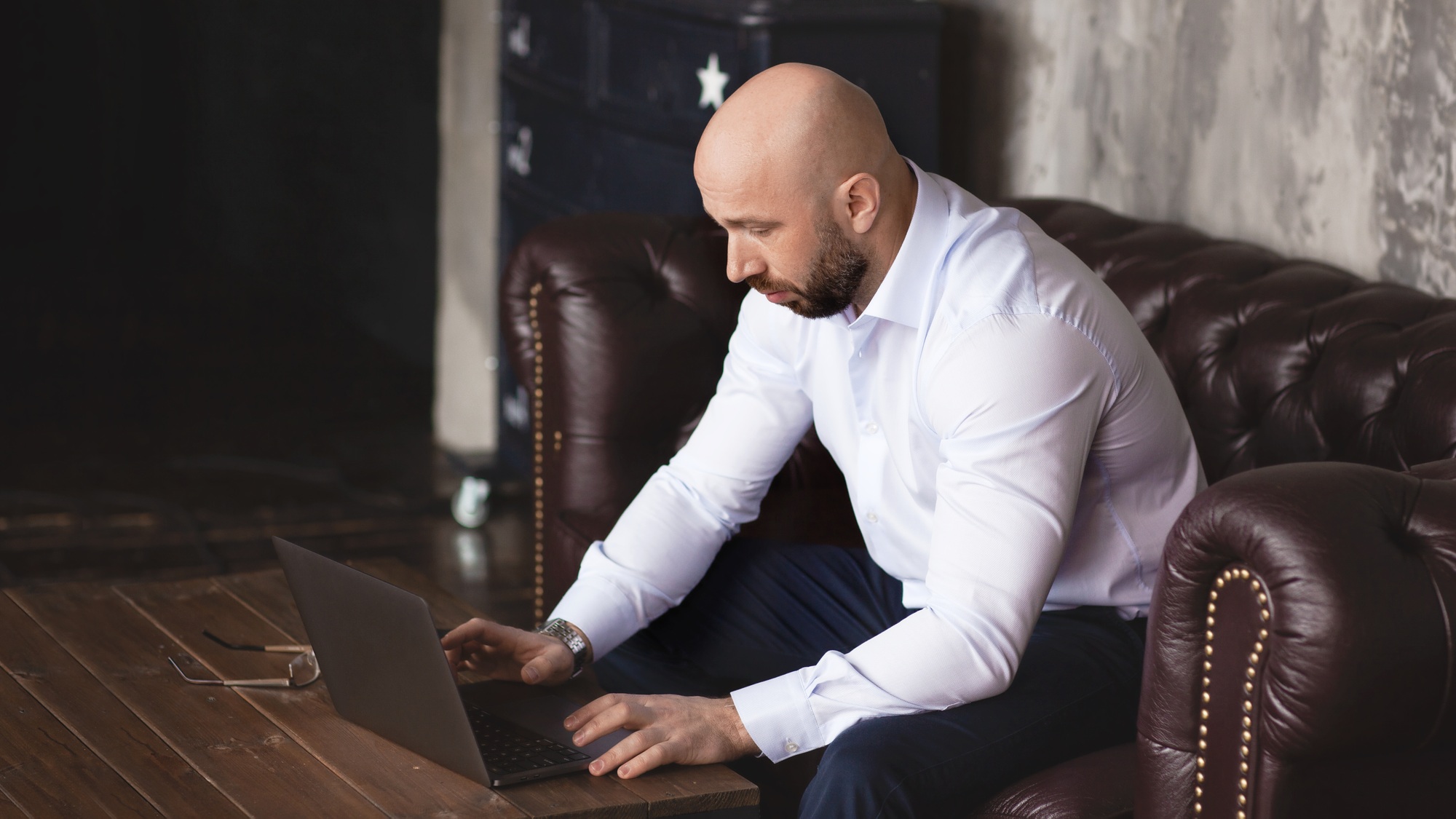 A businessman conducts business with the help of modern technologies in a hotel Work online
